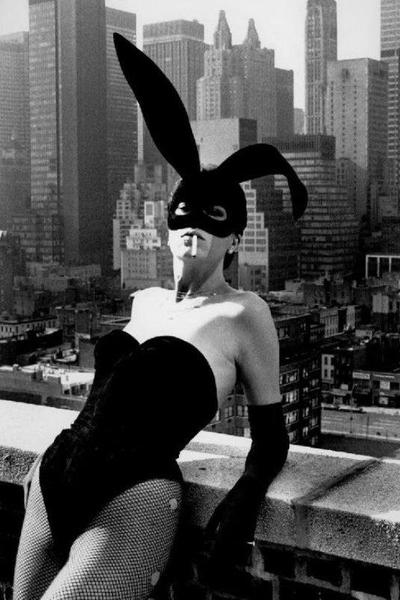 Alt Tag: Helmut Newton Elsa Peretti II New York 1975 vintage silver gelatin print, masked model in bunny ears on NYC rooftop skyline