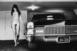 Alt Tag: Helmut Newton Hollywood Cadillac 1976 vintage silver gelatin print nude woman walking beside Cadillac in garage, black-and-white photo