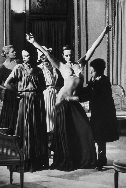 Helmut Newton Lanvin Fitting Paris 1980 vintage silver gelatin print black-and-white fashion fitting scene, model with arms raised in Paris