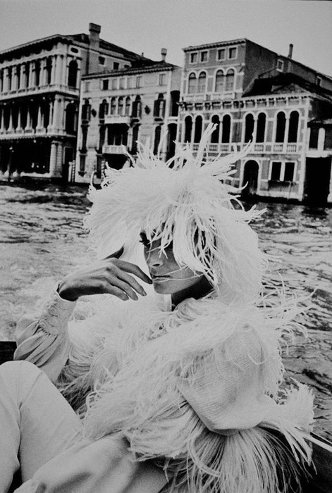 Alt Tag: Helmut Newton Model in Venice 1966 vintage silver gelatin print model in feathered couture on boat on Venice Grand Canal 1966