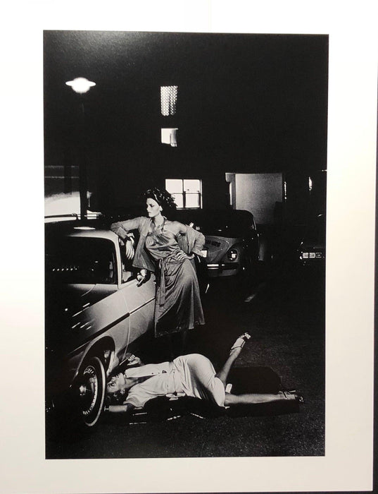 Helmut Newton Models Inspecting Brake Lining vintage silver gelatin print, Paris 1977 photo of models by car and under wheel