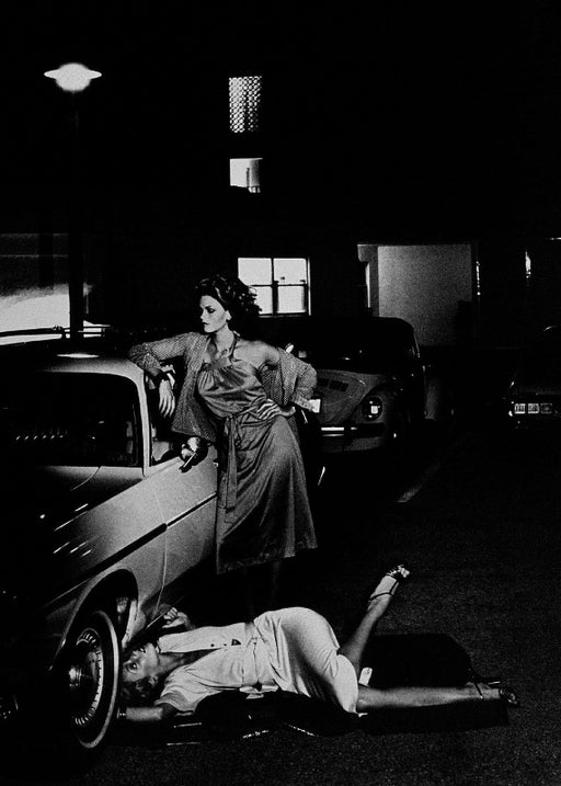 Helmut Newton Models Inspecting Brake Lining vintage silver gelatin print, Paris 1977 staged fashion scene by car at night