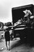 Alt Tag: Helmut Newton Niki Lauda Pirelli Calendar 1985 silver gelatin print, Monaco F1 scene with race car on truck and model
