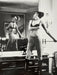 Alt Tag: Helmut Newton Saddle I (Bettina) vintage silver gelatin print mirrored Paris bedroom Bettina with whip, 1976 black-and-white photo