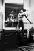 Alt Tag: Helmut Newton Saddle I (Bettina) vintage silver gelatin print Paris 1976 Bettina in mirrored bedroom holding whip 16x20