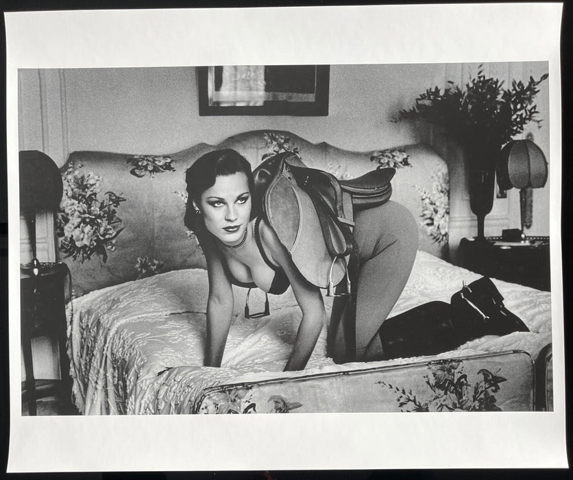 Alt Tag: Helmut Newton Saddle I Paris 1976 vintage silver gelatin print black-and-white photo of nude model on bed wearing saddle