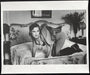 Alt Tag: Helmut Newton Saddle I Paris 1976 vintage silver gelatin print black-and-white photo of nude model on bed wearing saddle