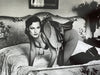 Helmut Newton Saddle I Paris 1976 vintage silver gelatin print, black-and-white nude model on bed with saddle, iconic fashion photo