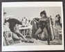 Helmut Newton Surprise St. Tropez 1981 vintage silver gelatin print beach fashion scene with model performing amid umbrellas and onlookers