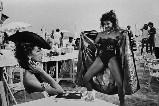 Alt Tag: Helmut Newton Surprise St. Tropez 1981 vintage silver gelatin print beach scene with model posing beside seated woman in hat