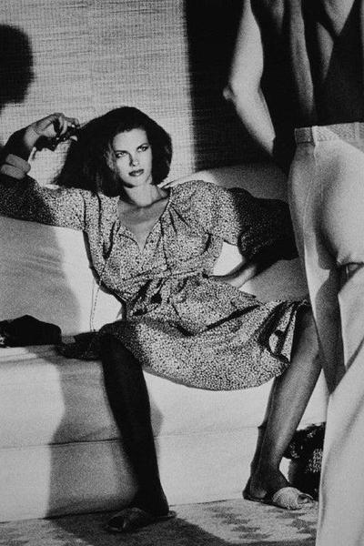Alt Tag: Helmut Newton Woman Examining Man vintage silver gelatin print Vogue Saint-Tropez 1975 fashion photo woman on sofa man standing