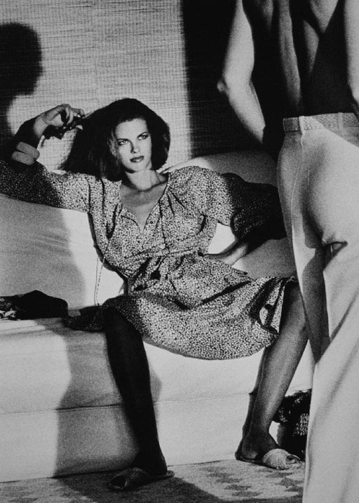 Alt Tag: Helmut Newton Woman Examining Man vintage silver gelatin print Vogue Saint-Tropez 1975 fashion photo woman on sofa man standing